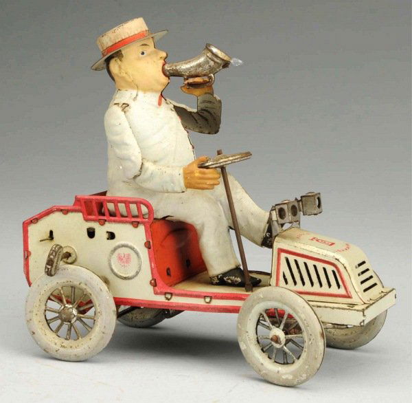 Tin Litho Lehmann Tut Tut Wind-Up Toy.: German. Mechanism is working but bellows is torn. Some general overall scratching and wear, especially to tires and bare metal parts. Condition (Very Good). Size 7" L.