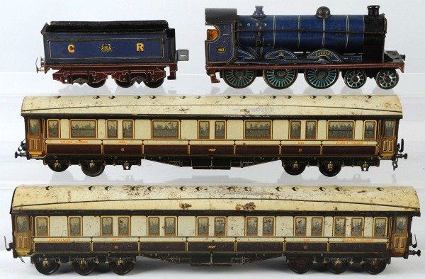 Tin Litho Wind-Up Passenger Train Set.: French. Pre-war. English style engine marked "903 Cardean" with replacement cab roof and missing one front stanchion. Comes with matching tender marked "CR" and two long passenger cars. Cars are missi