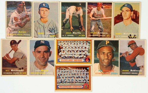 Lot of 11: 1957 Topps Baseball Cards.: Includes several HOFers consisting of no. 2 Yogi Berra, no. 76 Bob Clemente, no. 35 Frank Robinson rookie card, and others. The Clemente card is badly off-centered, as is the Berra card. The Robinson 