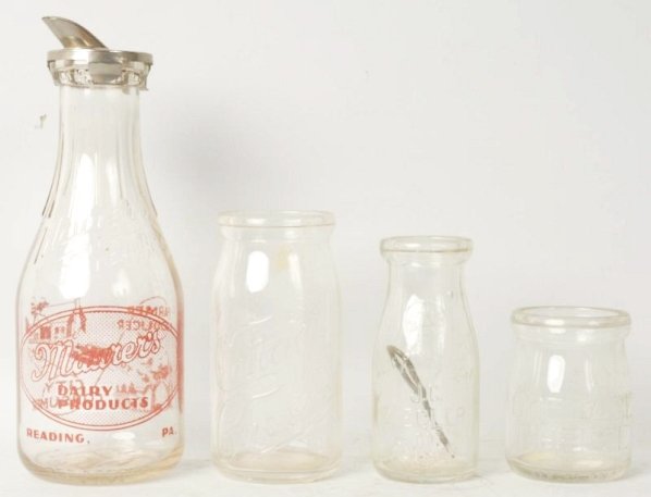 Lot of 4: Bottles.: Includes one Ziegler Reading milk bottle pint, one St. Lawrence Dairy bottle, one St. Lawrence pint jar, and one Maurers quart milk bottle. Condition (Excellent). Size Largest: 10 - 1/2" T.