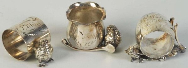 Lot of 3: Silver Plate Pieces.: Includes two napkin rings and one toothpick. Condition (Excellent).