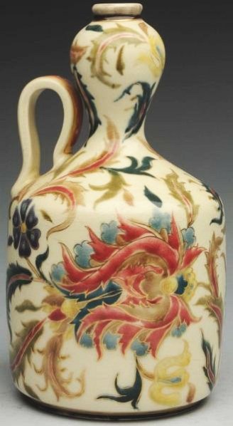 Zsolnay Persian Motif Vase with Gold Handle.: 8 - 1/4" T. Persian motif decoration with gold outlines. Zsolnay marks on underside with original paper label. (Mint).