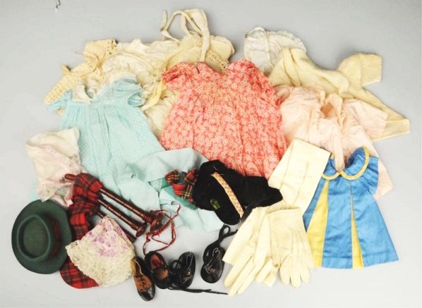 Lot of Antique Doll Clothing.: Three vintage cotton dresses, pink rayon coat, white flannel coat, four lace trimmed hats, crocheted dress, underwear, three silk and lace hankies, miscellaneous lace pieces, ribbons, glove for mendin