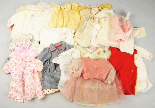 Lot of Antique & Vintage Clothing.: About 50 pieces, antique and vintage, mostly doll clothing but a few child’s items; cotton doll dresses of all sizes; flannel baby jackets; crepe and flannel night clothing, coats and hats, cotton b