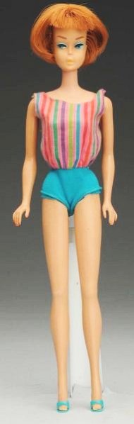 Titian American Girl Barbie.: This titian American Girl Barbie is in great condition. She does not have green ears and there are no splits to the plastic. She includes her original swimsuit and shoes. Condition (Excellent).