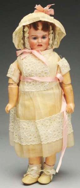 Wonderful 3-Face German Doll.: Bisque head with three faces -- sleeping, laughing and crying -- turns on a dowel attached to a ring on the top of a papier-mâché hood which hides the unwanted faces; stamped C.B. on the back for Ca