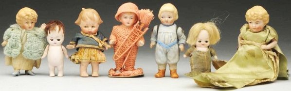 Lot of 7: All-Bisque Dolls.: All are German. Chimney sweep is rose crochet, needle and pin case doll in green satin, girl with molded blonde hair, Campbell Kid in blue suit, two Hertwig characters with glass eyes, Peterkin-type i
