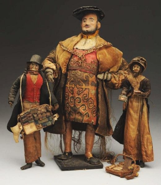 Lot of 3: Dolls.: Pair of early English peddler dolls, Ca. early 1800s, no labels but the type made by C & H White, Milton, Portsmouth, England, with shaped leather heads, bead eyes and mohair wigs (some wear on faces)