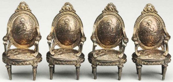 Lot of Doll House Chairs.: Ornate white metal hallmarked, but impossible to read, possibly silver, lovely quality with molded designs on backs and seats of chairs. Condition (Excellent).