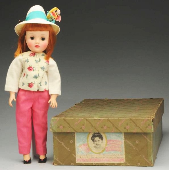 Colorful Alexander "Maggie Mixup" Doll.: Hard plastic and vinyl with straight red hair, freckles, lashed sleeping eyes (one green, one brown), perfect complexion, rosy cheeks, rosebud mouth; original tagged outfit with hat, stockings and sho