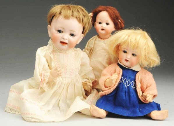 Lot of 3: German Bisque Dolls: Hertel, Schwab & Co. 150 head with sleeping eyes, open/closed mouth, original wig, original composition baby body (soil, wear) with original finish; Heubach Koppelsdorf 320 with sleeping eyes, pierced