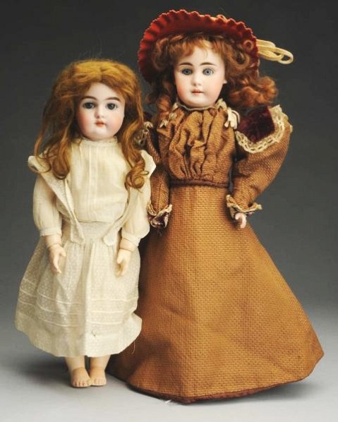 Lot of 2: German Bisque Dolls.: Bisque shoulder head incised only “8” of excellent quality, multi-stroked eyebrows, sleeping eyes, open mouth with molded square cut upper teeth, original mohair wig, original gusseted kid body (s