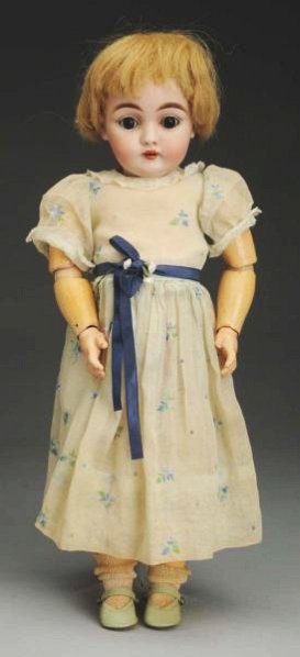 Winsome Kestner 143 Child Doll.: German bisque socket head incised “G made in Germany 11 143” with multi-stroked eyebrows, sleeping eyes (some wax loss), open mouth with upturned upper lip and two teeth, bobbed human hair wig; or