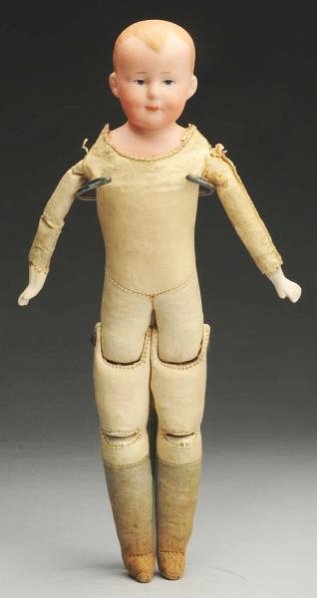Cute A.M. 600 Character Doll.: German bisque shoulder head incised “600 A 5/0 M Germany” made by Armand Marseille with molded and painted hair, intaglio eyes, dimples, closed mouth; original kidilene body with bisque hands and 