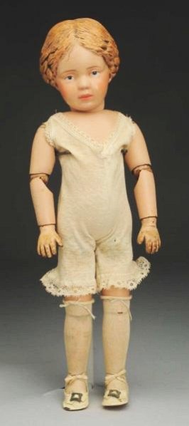 Carved hair Schoenhut Girl Doll.: All wood doll made in Philadelphia with Schoenhut incised mark, intaglio eyes, carved hair with hair bow (head has been restored); spring jointed body (wear on fingers); original Schoenhut union suit,