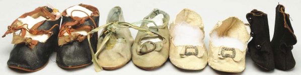 Lot of 4: Pairs of Antique Doll Shoes.: Blue cloth (toe ornament missing on one, sole bent); white leather with toe ornament; black oilcloth with brown trim; black suede boots with heels. All with some wear. Condition (Good). Size Largest: