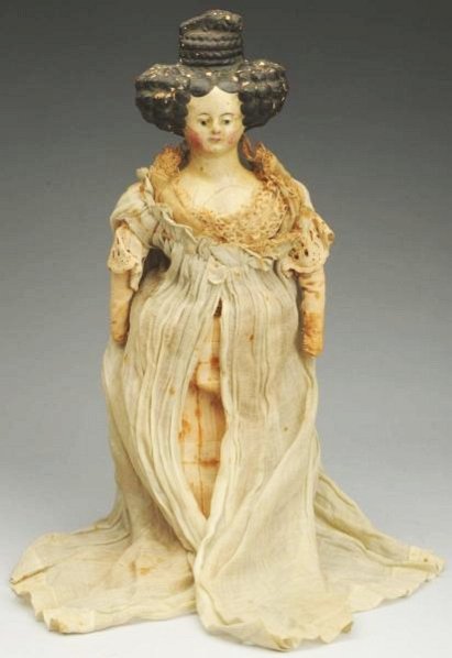 German Paper-Mache Doll.: Very fancy molded hair in exaggerated Apollo Knot style with painted facial features (needs cleaning, wear on hair, a few cracks, a little bit of edge of back plate missing); handmade antique cloth bo