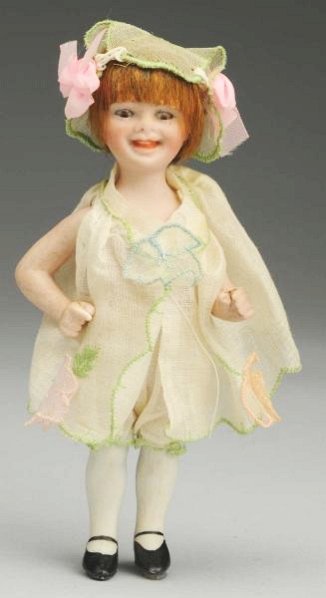 Smiling All-Bisque "Orsini" Girl.: Character doll incised “JIO©1919 47” (short 1/8” firing line on back crown rim) designed by Jeanne Orsini with tiny sleeping eyes, wide smiling mouth with molded upper teeth, original bobbed mo