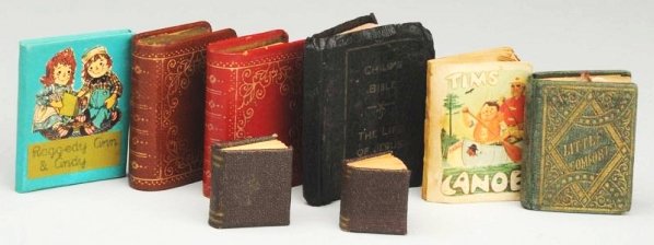 Lot of Miniature Books.: Antique and vintage, two with red bindings and gold decoration have drawers that come out, 1863 “Little Comfort” by Aunt Laura, two mini blank books, Tim’s Canoe, tiny bible “Life of Jesus”,