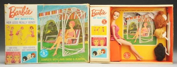 1964 Miss Barbie with Original Box.: This 1964 Miss Barbie appears to be mostly complete with wigs, wig stand, planter, magazine, radio, shoes, lawn swing, and swimsuit. Her cap appears to be missing. The box lid has several split corner