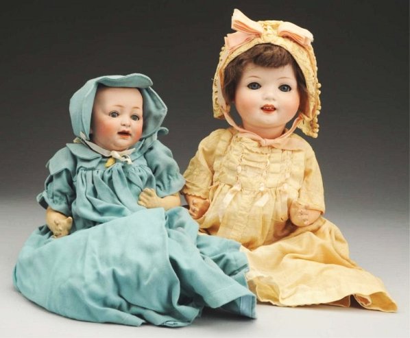 Lot of 2: German Bisque Baby Dolls.: JDK bald head character baby with sleeping eyes (eyelid wax missing) and open mouth with teeth, composition baby body (repainted). Ernst Heubach 300 character baby with sleeping eyes (eyelid wax missi