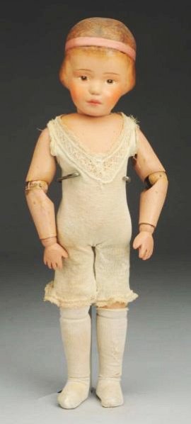 Carved Hair Schoenhut Girl Doll.: All wood doll made in Philadelphia with Schoenhut decal, intaglio eyes, carved hair with hair band (head has been restored); spring jointed body (soil and wear); original Schoenhut union suit and stoc
