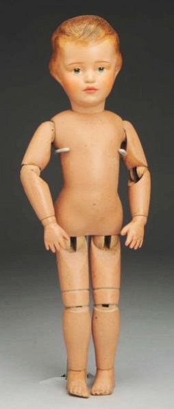 Carved Hair Schoenhut Boy Doll.: All wood doll made in Philadelphia with Schoenhut decal, intaglio eyes, feathered eyebrows, carved short brown hair, (head has been restored); spring jointed body (soil, wear). Wonderful face! Conditi