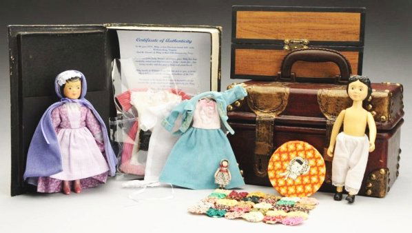 Lot of 2: Artist "Hitty Dolls".: Carved Hitty in trunk with some accessories signed Elaine Pilsitz 2000, Hitty hatbox with bonnet, “Hitty Visits Williamsburg” doll by Judy Brown with two additional outfits, with very nice wood tr