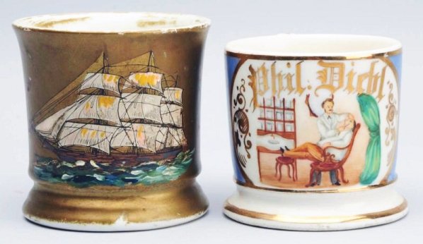Lot of 2: Shaving Mugs.: The first mug depicts a ship and has been sprayed with gold paint and the second mug depicts a dentist and has "Phil Diehl" in gold gilt. With a blue wrap and little gold loss. Condition (Good - Excel