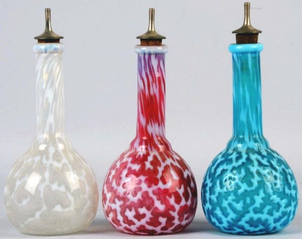 Lot of 3: Barber Bottles.: Includes one red, one white and one blue. All are the same design. No cracks, chips or repairs. Condition (Excellent). Size Each: 8 - 1/2" T.