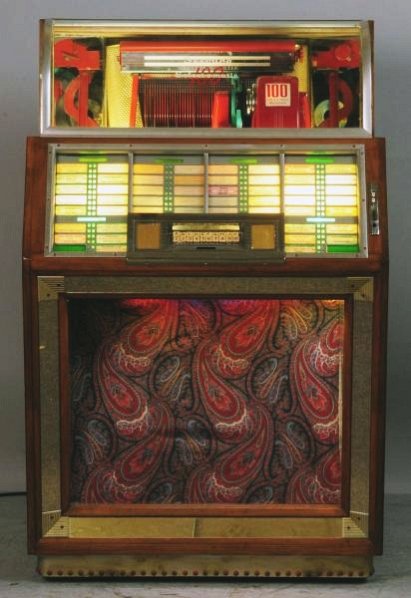 Seeburg Select-O-Matic M100B Jukebox.: Lights. Works, but will need a stylus. Stylus is missing. Key is included. Circa 1950. Note: speaker for this machine is Lot 1052. Condition (Very Good). Size 54" T.