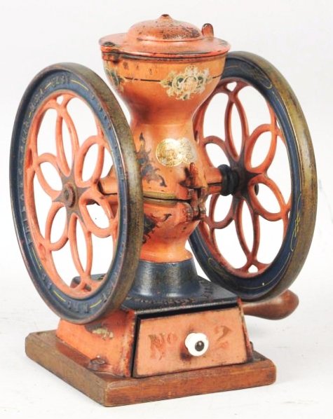 Red Cast Iron Enterprise Coffee Grinder.: Early and displays well with light wear and slight fading to paint. Original paint, decals, and stencils remain. Condition (Excellent). Size 12 - 1/2" T.