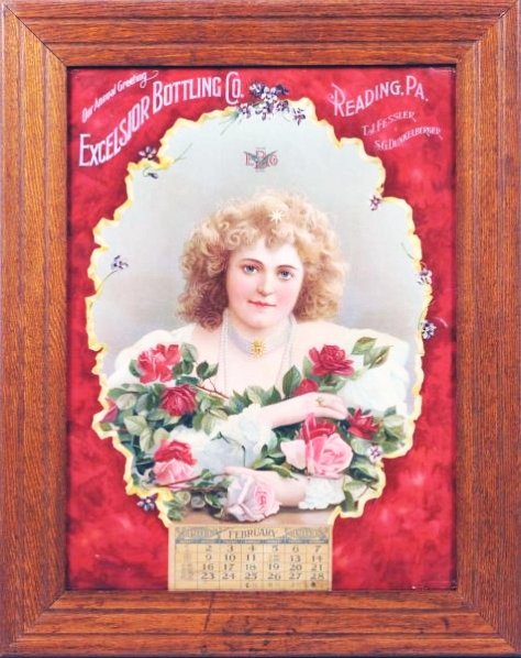 Reading, PA Excelsior Bottling Co. & Hilda Clark.: In period oak frame and displays a February 1903 calendar page. This poster/calendar is believed to feature Hilda Clark, who was used extensively by Coca-Cola during this period as a model who endorse