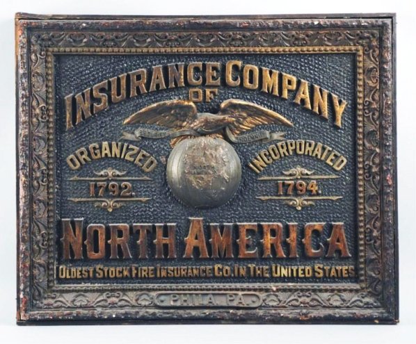 North America Insurance Co. Advertising Sign.: In the form of a shadow box. Made out of composite material in a wooden frame. The image is in relief. Depicting an eagle on top of a globe. From Philadelphia, Pennsylvania. Modest wear. A very rare a