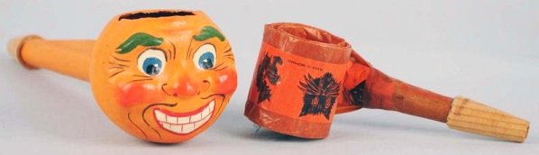 Lot of 2: Halloween Noisemakers.: Includes a pumpkin head and a blow horn. Condition (Excellent). Size Largest: 7 - 1/2" L.