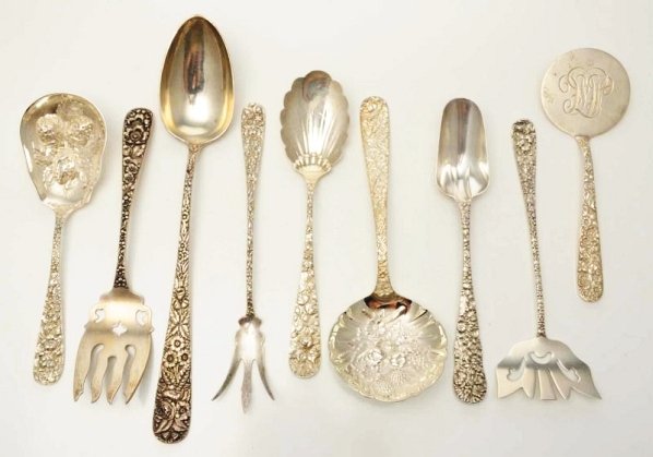 A Group of American Silver Repoussé Servers.: By Kirk and other makers and in similar floral patterns, including a serving spoon; a pair of berry spoons, 2 spoons with large round bowls; a bacon fork; a lettuce fork; and others. Good condition; a