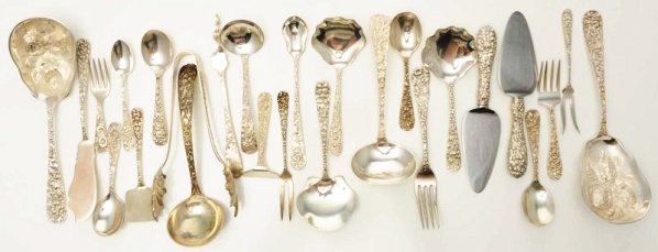 A Group of American Silver Repoussé Flatware.: Mostly Kirk and other makers of similar floral patterns, including a pair of berry spoons; 2 gravy ladles; a pair of small cheese knives with stainless blades; a pair of shell-bowled tongs; a butter k