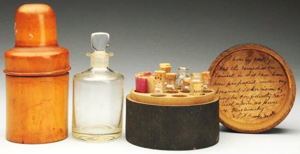 Lot of 2: Early Wooden Apothecary Cases.: Circa 1890. With glass bottles. Condition (Excellent). Size Largest Case: 5 - 3/4" T.Largest Case: 5 - 3/4" T.(Excellent).