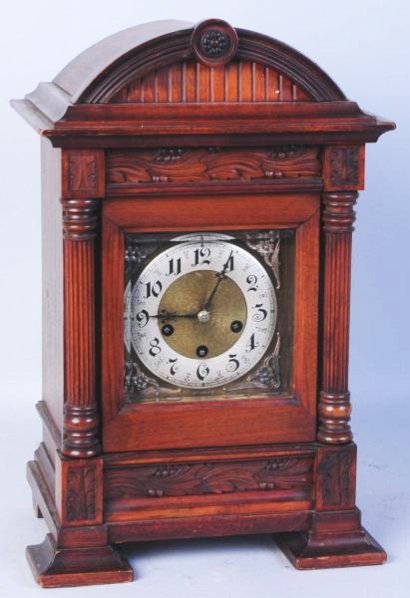 German Wooden Mantle Clock.: Quarter strike and chime, with pendulum. Develed glass front. Condition (Excellent). Size 18 - 3/4" T.18 - 3/4" T.(Excellent).