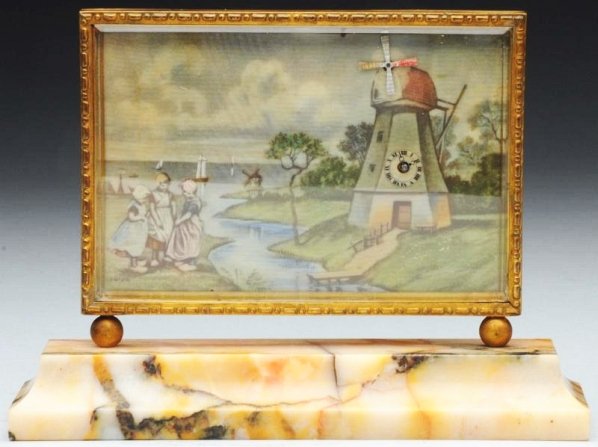 Deidesheim Swiss Made Mechanical Clock.: A very fine Swiss mechanical clock by Deidesheim. Depicting a Dutch scene with an automoton windmill that turns. Mounted on a multi colored alabaster base. Signed on reverese. Condition (Excellent). S