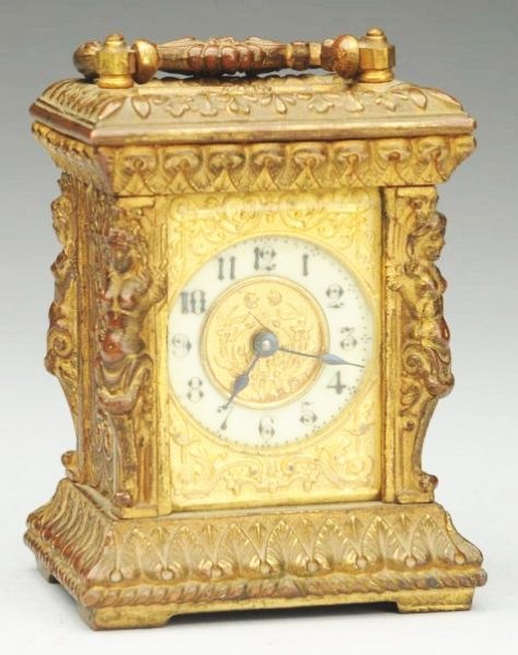Ornate French Carriage Clock.: With brass and porcelain dial and full bodied women on four cornices. Circa 1880. Condition (Excellent). Size 3 - 3/4" T.3 - 3/4" T.(Excellent).