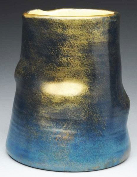 Clement Massier Ceramic Iridized Vase.: An organic tree trunk shape. Base is marked, "Clement Massier, Golfe Jaun (A.M.) L. Levy". Condition (Mint). Size 10" T.10" T.(Mint).