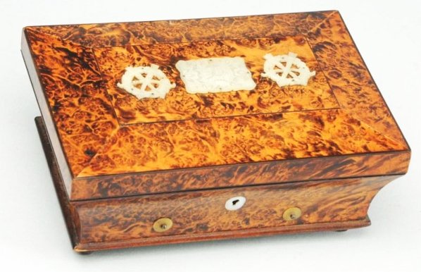 Vintage Sewing Kit Music Box.: 1860. Music box. All combs intact. Burly walnut case with mother of pearl implements. Includes scissors, bobbin, perfumes, needle case, thimble linen and key. Condition (Excellent). Size 6 - 1/2" x 4