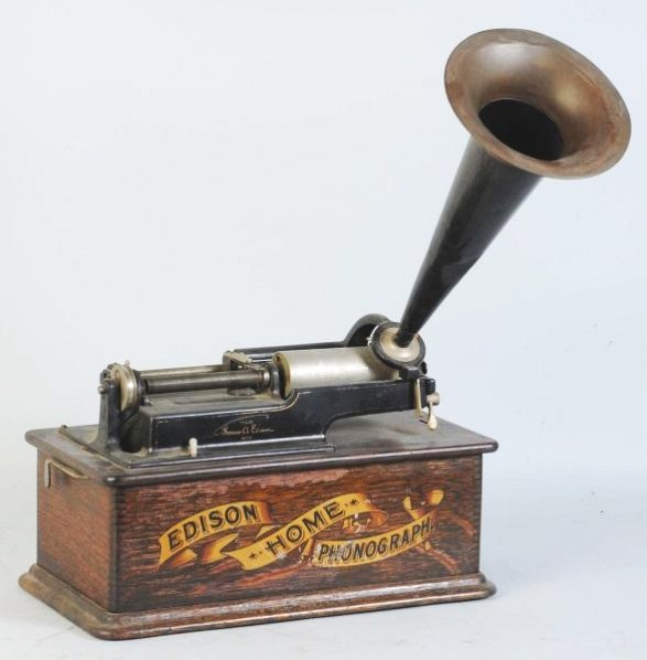 Edison Home Phonograph.: With brass horn. Missing crank and lid, but otherwise appears complete. Condition (Very Good). Size 16" L.16" L.(Very Good).