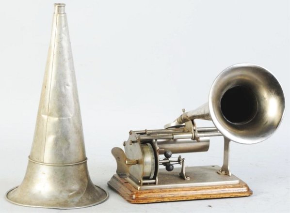 Columbia Q Phonograph.: Base is refinished. No lid and includes two horns. One horn is in bad shaped. Condition (Good). Size Phonograph: 9" W. Horn: 13 - 1/2" T.Phonograph: 9" W. Horn: 13 - 1/2" T.(Good).