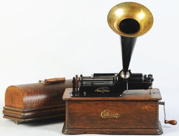 Edison Home Phonograph.: With broken spring. Includes horn. Condition (Good). Size Phonograph: 16 - 1/4" W. Horn: 14" T.Phonograph: 16 - 1/4" W. Horn: 14" T.(Good).