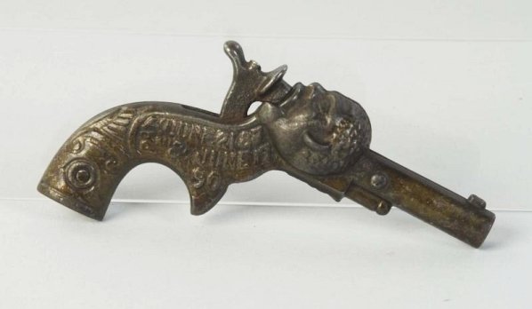 Early American Cast Iron Sambo Cap Pistol.: Embossed Sambo on one side has a patent date of 1890. Depicts cap pistol with hammer pistol going into an African American mans head. Japan has been used there is some wear and oxidation on barrel. Pr
