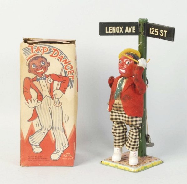 Occupied Japan Tin & Celluloid Tap Dancer Toy.: African American version. Scarce original box. Box marked in Occupied Japan Alps. Box has some tearing and creasing. One top inner flap is detached and missing and one outer flap is detached but prese