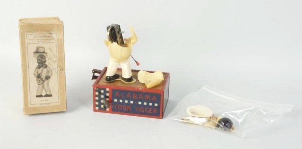 Lot of 2: Black Memorabilia Toy Parts.: Base for a lamen roof dancing toy and a box with some cellular parts for a german Jazz King toy. Condition (Good). Size Box: 5 - 3/4" T.