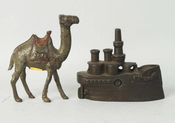 Lot of 2: Cast Irons Still Banks.: Includes a large camel and an organ boat still bank. Condition (Very Good - Excellent). Size Largest: 5" L.